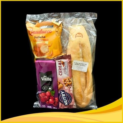 Kit essencial para café da manhã, contendo Baguete c/ pasta de frango c/ milho, Suco 200ml, Bolinho Bauducco de Laranja, Barrinha de cereal.